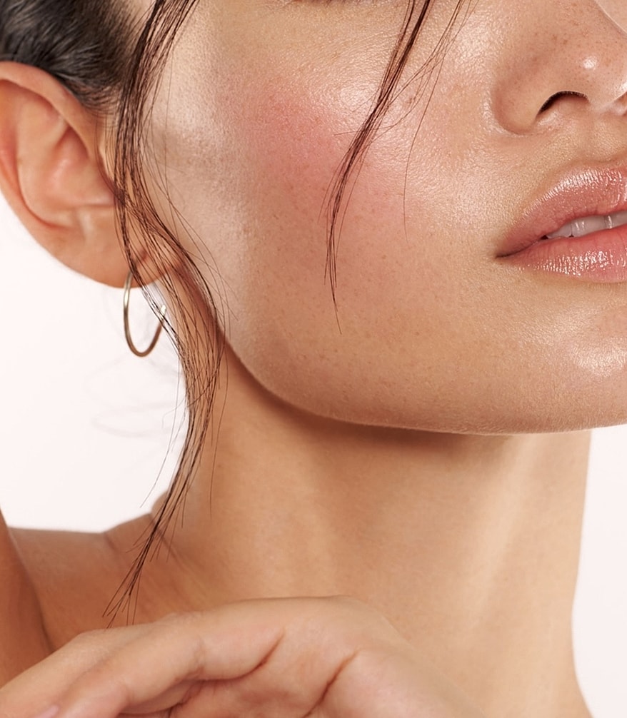 Close-up of radiant skin and subtle makeup.