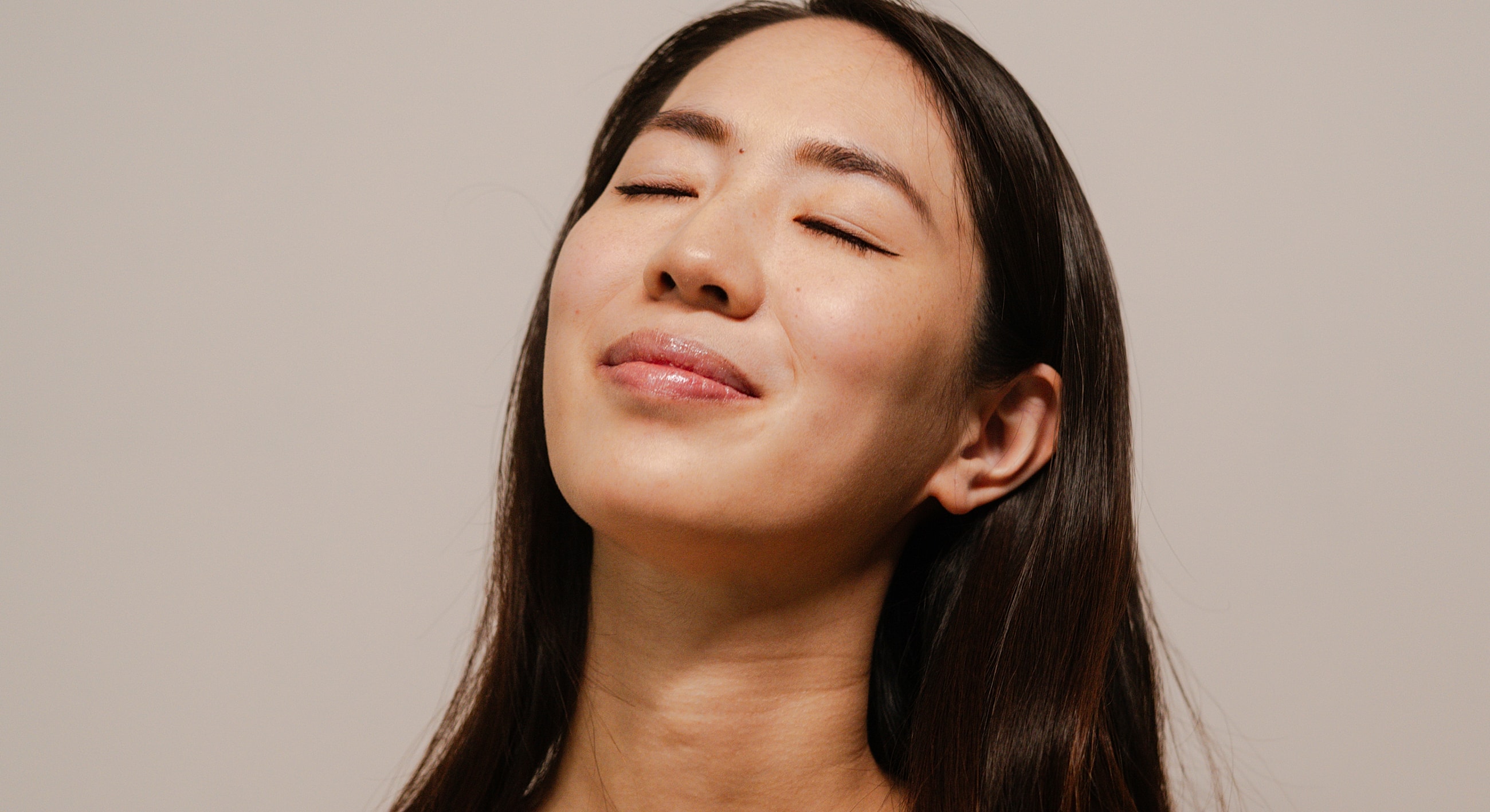 Model posing elegantly with thoughtful expression.